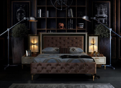 Elegant Chesterfield comfort bed with gold legs and matching bedside tables
